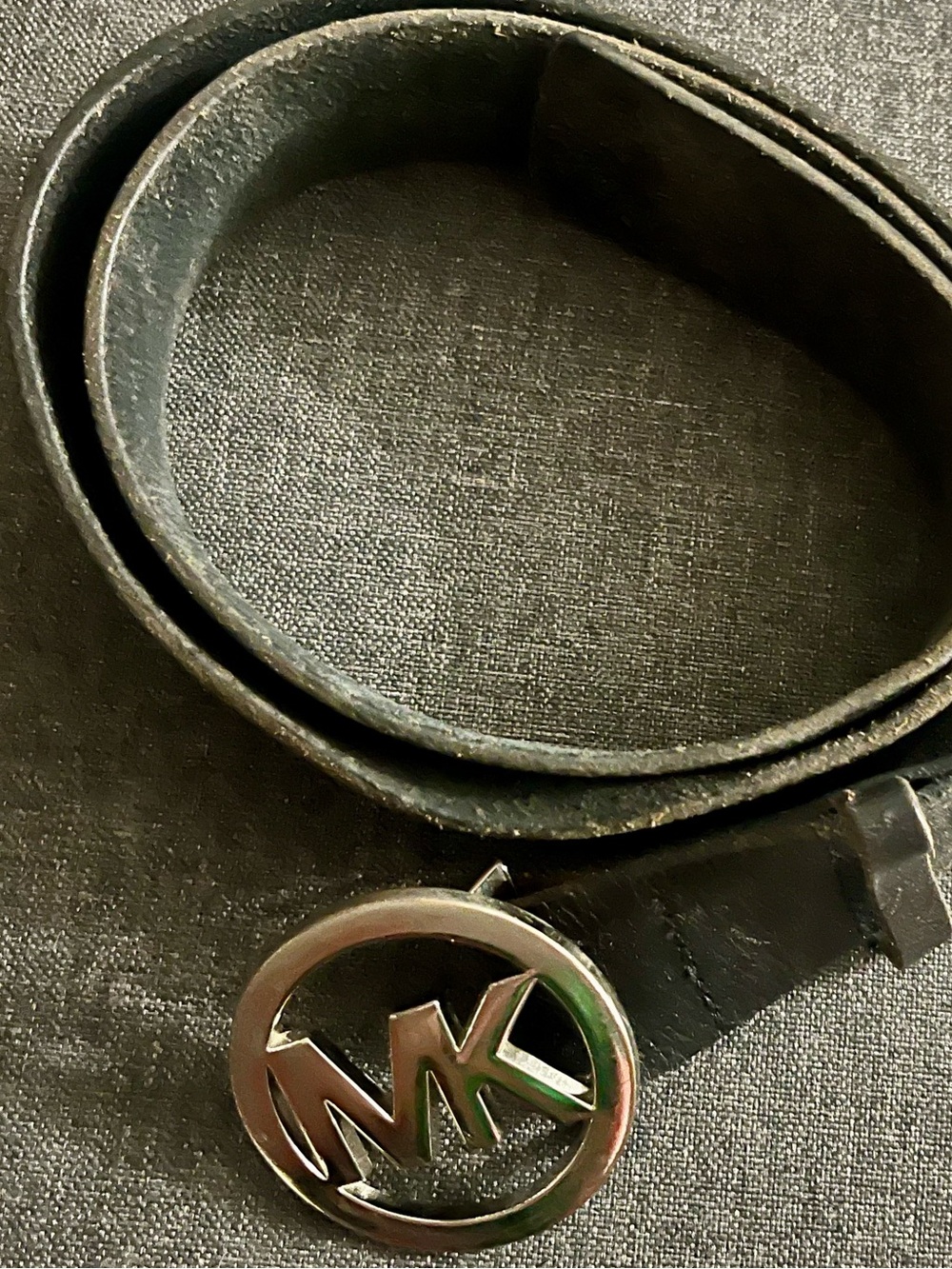 MK silver and black leather belt.